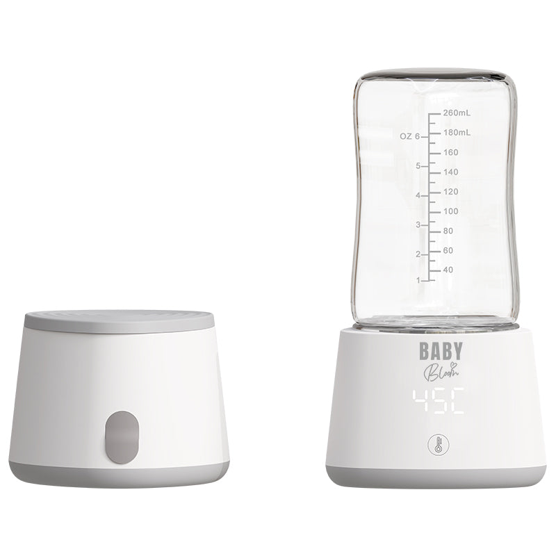 جهاز تدفئة الزجاجات المحمول من بيبي بلوم مع ٥ أدابتر